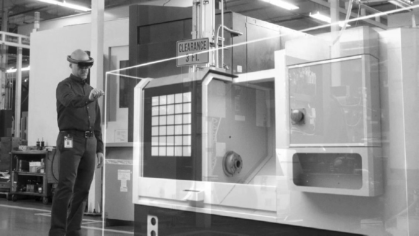 Click to enlarge Worker operating a complex machine with AI glasses