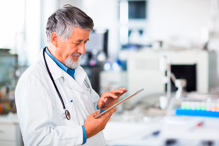 doctor using tablet computer